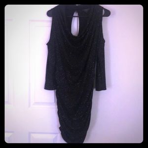 Black cocktail dress by Guess.